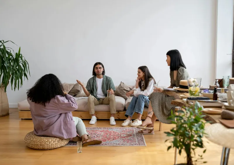 Four people sitting and enjoying conversation