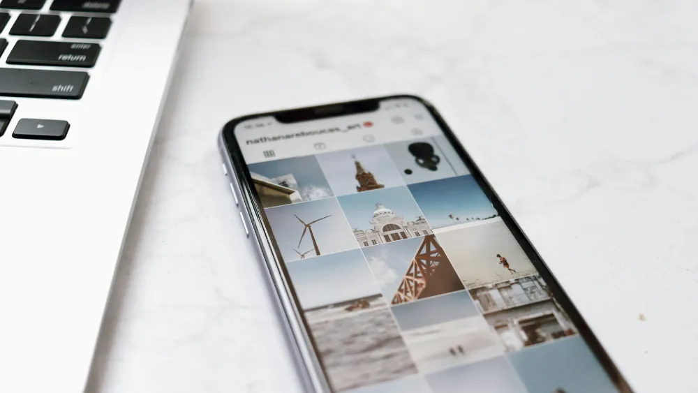 an iPhone showing professional photography on an Instagram account
