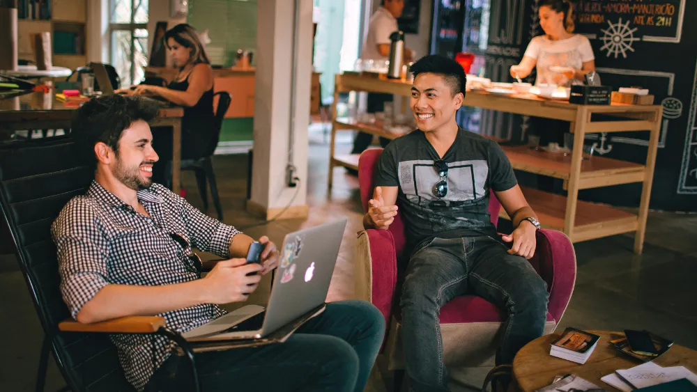 Two men collaborating in a community business space