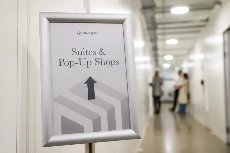 signage showing the way to the suites and pop-up shops